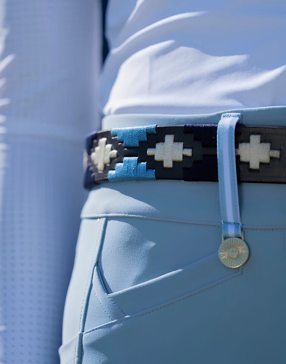 La Regalia Polo Belt in dark chocolate leather with Argentine blue stitching and signature silver stirrup buckle, equestrian accessories